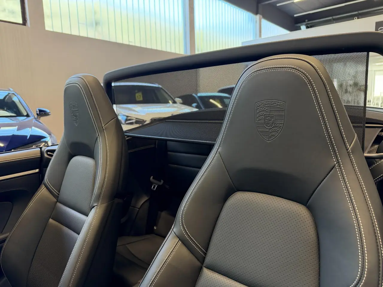 Porsche 911 Carrera S Cabrio (992) 2025, rear view — Luxury Car Rental Switzerland, Switzerland. Porsche 911 Carrera S Cabrio (992) in Switzerland The Porsche 911 Carrera S Cabrio (992)…