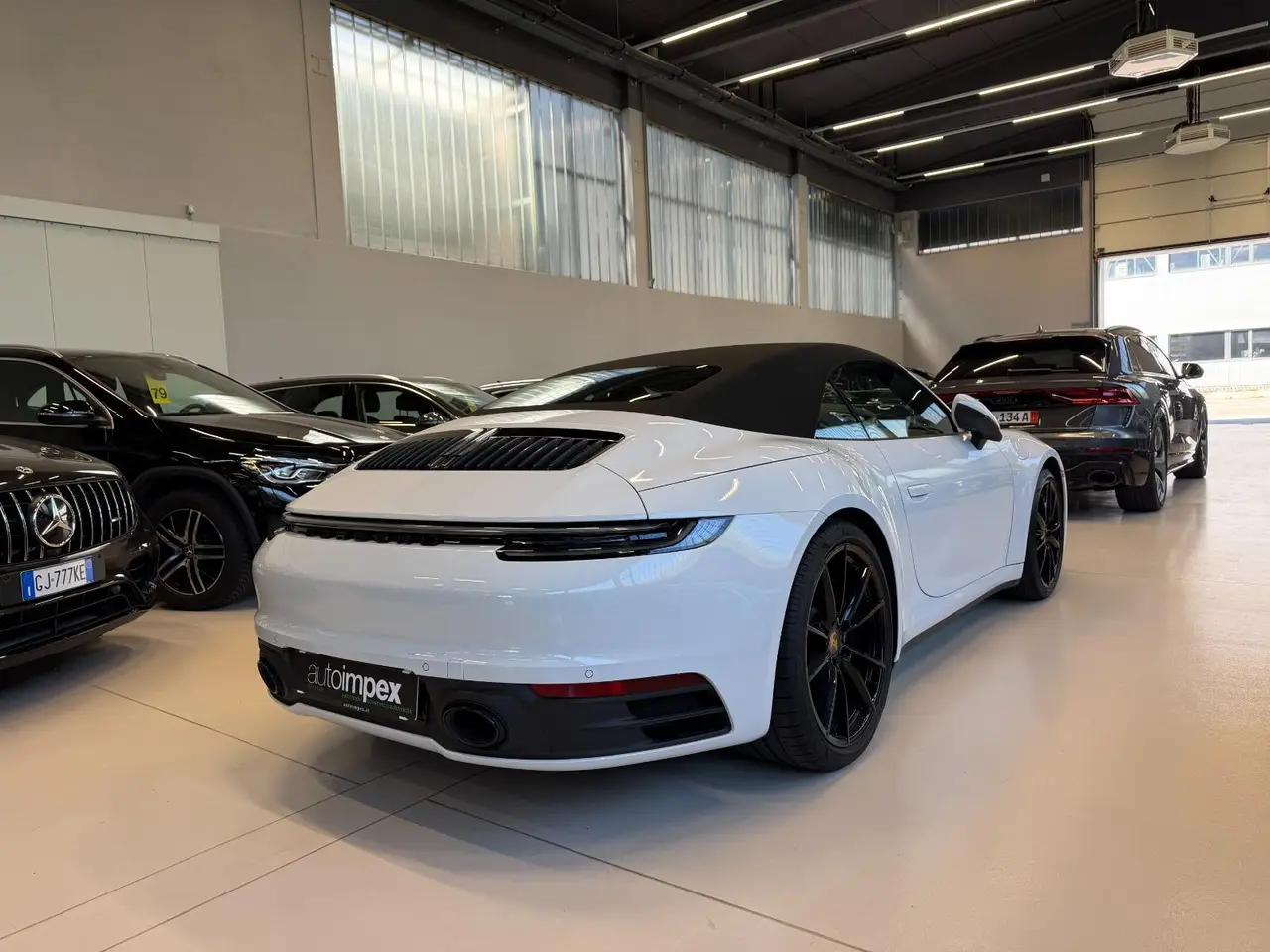 Porsche 911 Carrera S Cabrio (992) 2025, side profile — Luxury Car Rental Switzerland, Switzerland. Porsche 911 Carrera S Cabrio (992) in Switzerland The Porsche 911 Carrera S Cabrio (992)…
