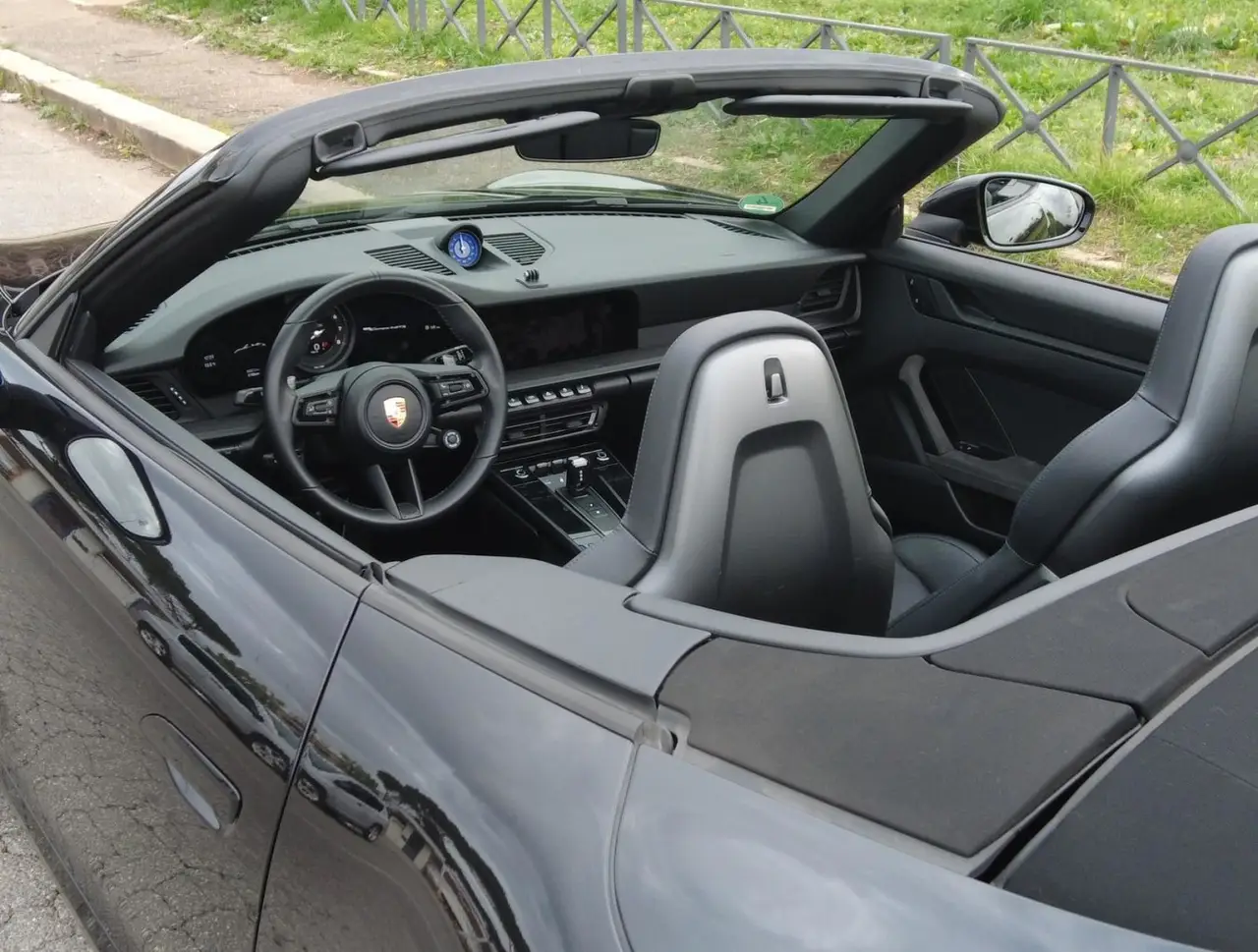 Porsche 992 Carrera 4 GTS Cabrio 2024, interior — Luxury Car Rental Switzerland, Switzerland. Porsche 992 Carrera 4 GTS Cabrio in Switzerland The Porsche 992 Carrera 4 GTS Cabrio is…